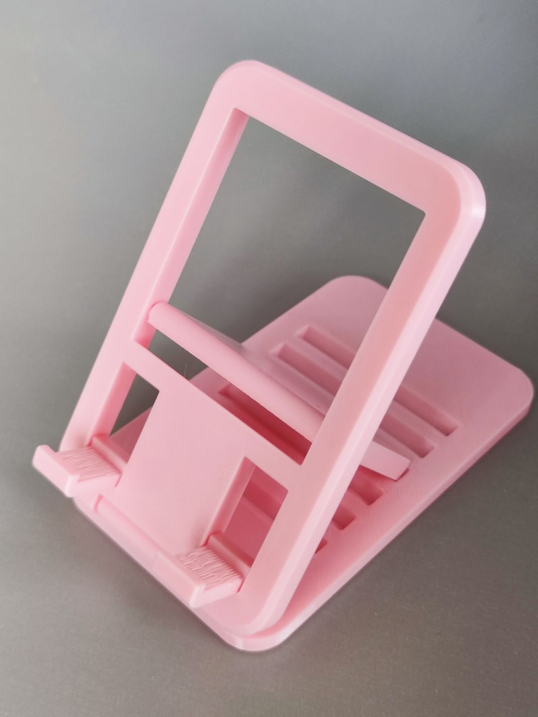 Pink 3D printed adjustable phone stand